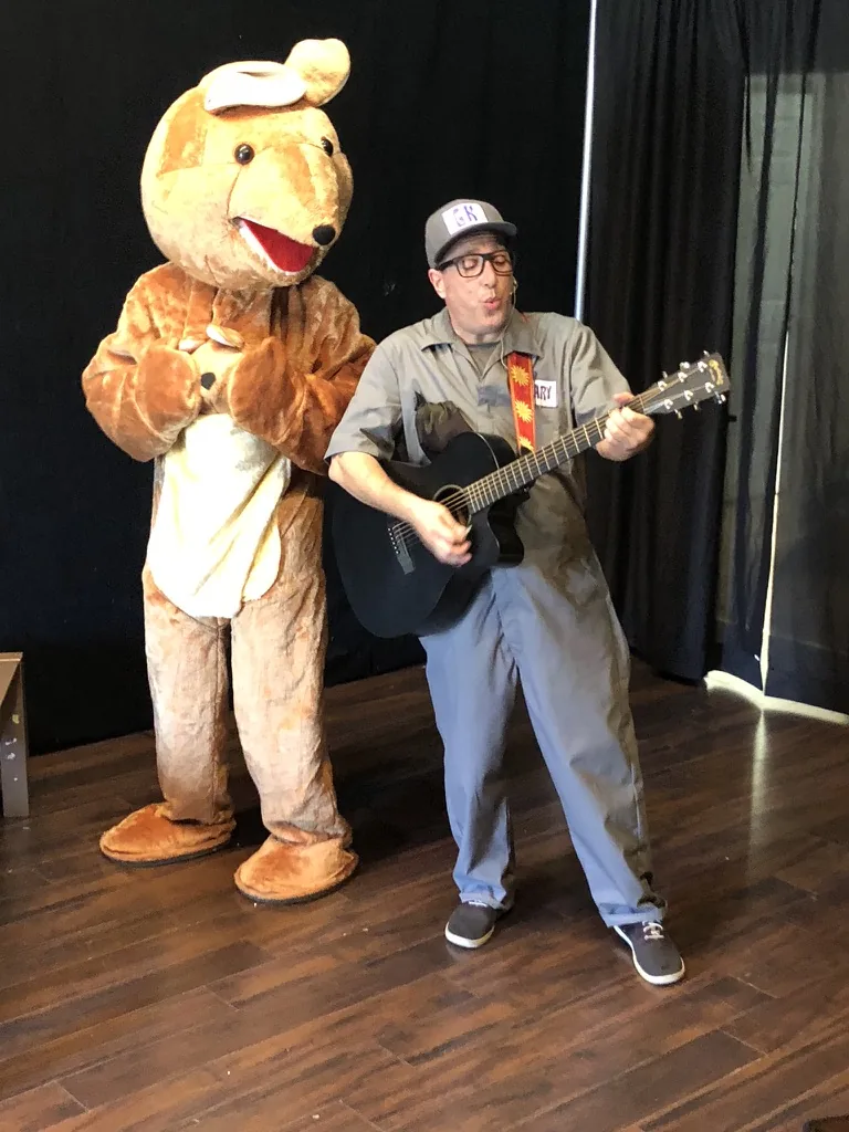 Gary Kazoo performing with a kangaroo character